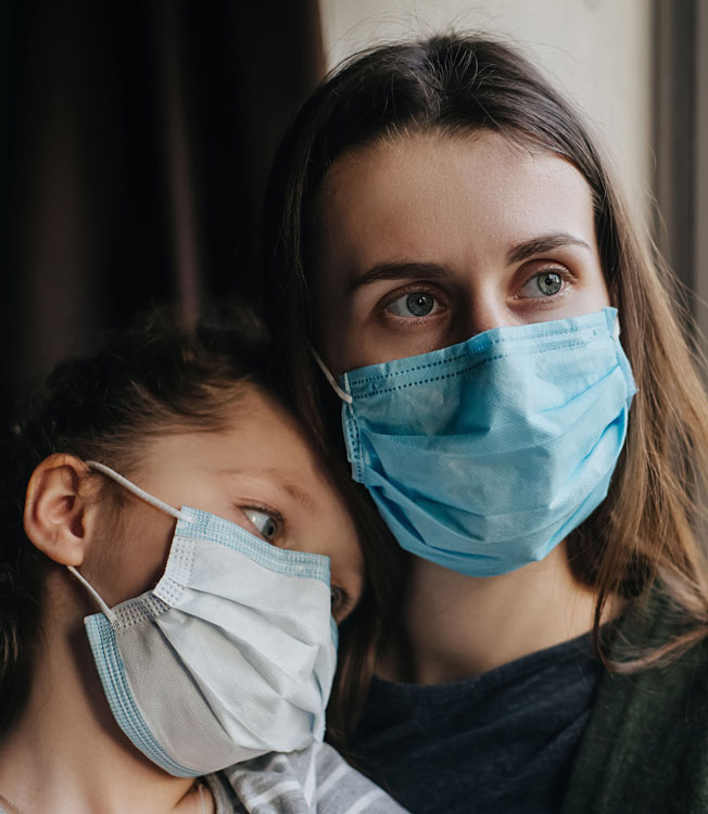 mother and daughter with facemasks